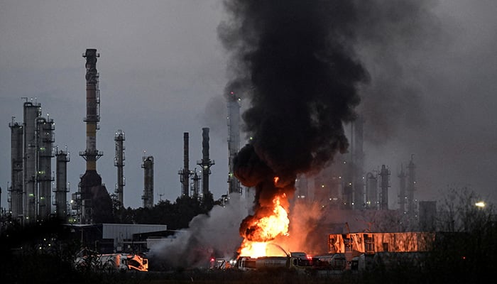 Smoke and fire rise at an impacted facility site following missile attack from Iran on Israel, at Haifa, Israel June 15, 2025. — Reuters