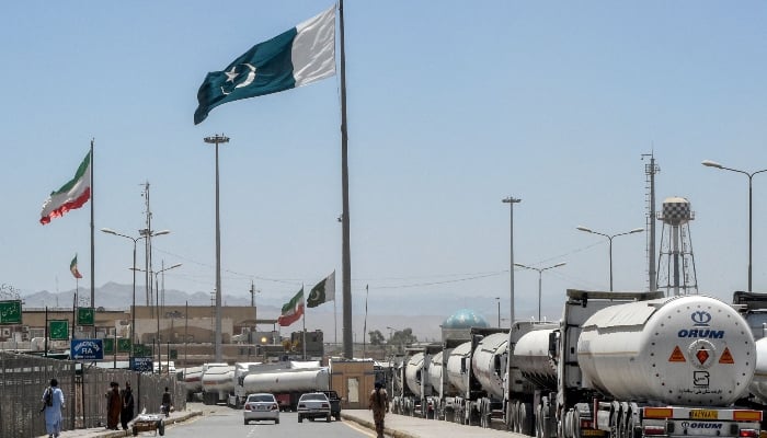 Iranian tankers stand in a queue waiting at the Pakistan-Iran border at Taftan, Balochistan province on June 18, 2025. — AFP
