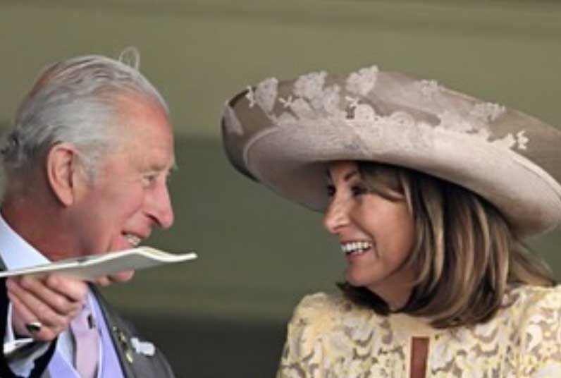 King Charles beams as he talks to Kate Middletons mother