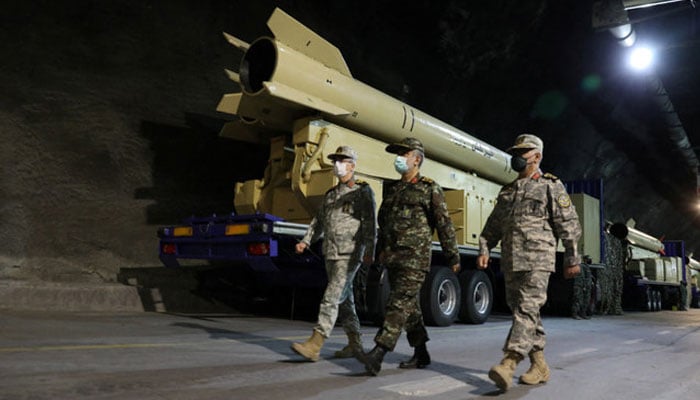 Iranian military officials can be seen walking during the unveiling of Kheibarshekan missile at an undisclosed location in Iran in this undated picture. — Reuters/File