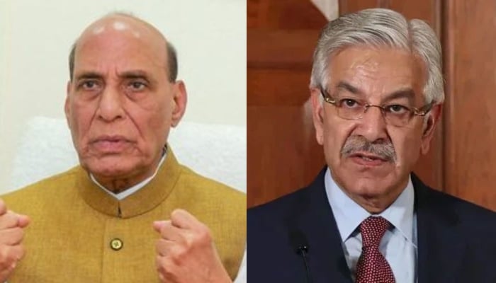 Defence Minister Khawaja Asif (right) and Indias Defence Minister Rajnath Singh. — AFP/File