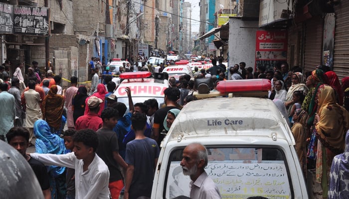 Ambulances at the site of the building that collapsed in the Baghdadi area of Lyari, Karachi, on July 4, 2025. — Geo News