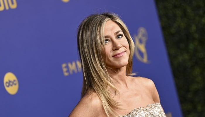 Photo: Jennifer Aniston leans on rumoured beau James Curtis for support: Source