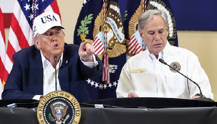 US President Donald Trump and Texas Governor Greg Abbott  at a roundtable with first responders and local officials in Kerrville, Texas, July 11, 2025. —Reuters