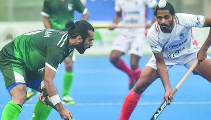 Pakistan and Indian hockey team players pictured during a match. — AFP/File
