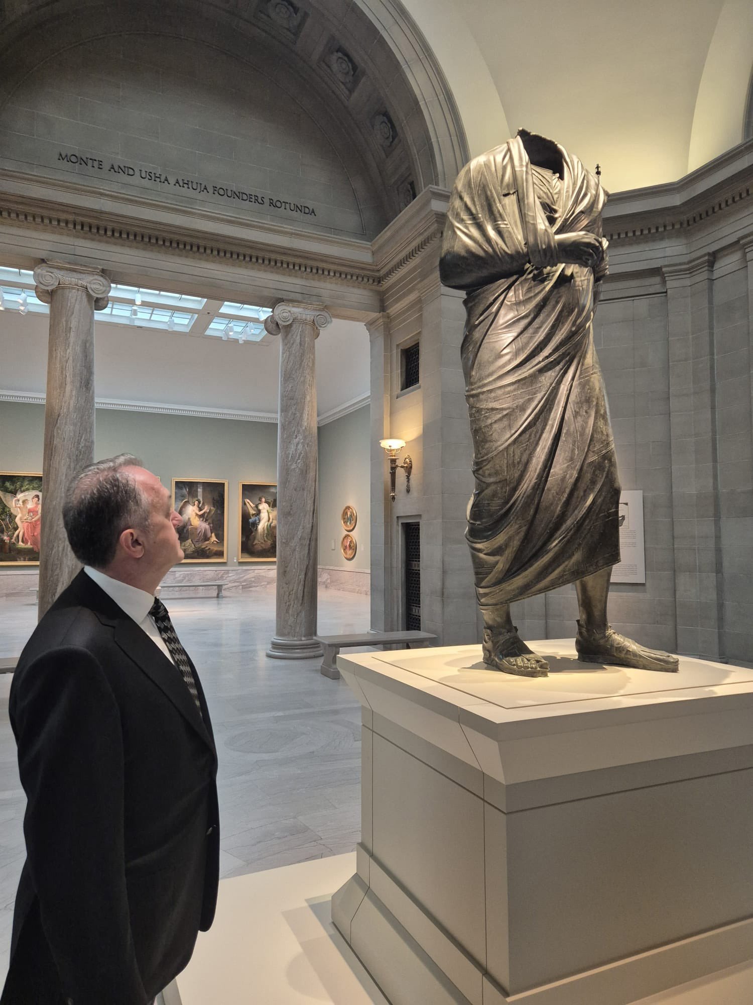 Turkiyes Deputy Culture Minister Gökhan Yazgı stands next to an ancient statue that depicts Roman emperor and philosopher Marcus Aurelius. — @yazgi_gokhan