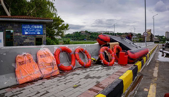 Rescue teams are preparing rescue gear after the water level of the Swan River rose during heavy monsoon rains, a red alert has been issued in the twin cities on July 22, 2025. — APP