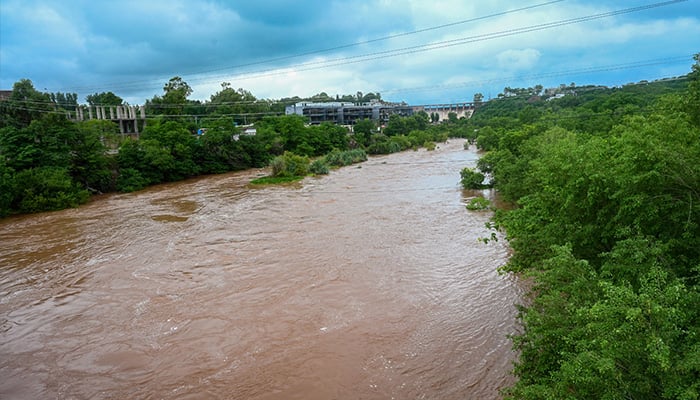 A view of the Korang Nullah connected to Rawal Dam on July 22, 2025, where the water level has risen following the opening of the dams spillways as a precautionary measure due to recent heavy rains. — APP