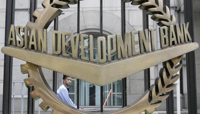 A worker walks past inside the Asian Development Bank (ADB) headquarters in this file photo. — Reuters