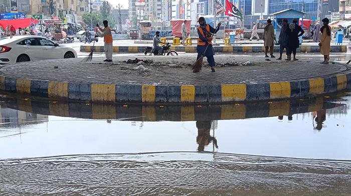 Holiday offers little relief as Karachi's working class braves flooded streets