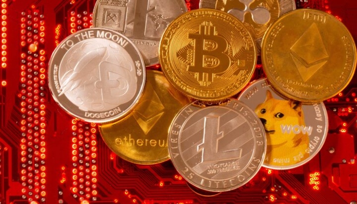 Representations of cryptocurrencies Bitcoin, Ethereum, DogeCoin, Ripple, Litecoin are placed on PC motherboard in this illustration. — Reuters