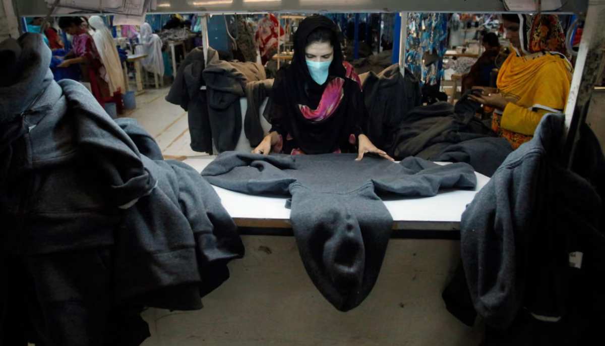 A female worker inspects the fabric for quality at a garment factory in Faisalabad. — Reuters/File