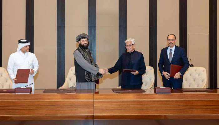 Defence Minister Khawaja Asif shakes hands with his Afghan counterpart Mullah Yaqoob after reaching a ceasefire deal with the Taliban authorities in Doha, Qatar, on October 18, 2025. — X@KhawajaMAsif