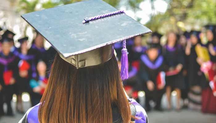 A representational picture of a student during a graduation ceremony. — Unsplash