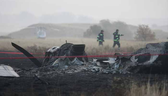 Members of emergency services work at the site of the Turkish C-130 military cargo plane crash near the Azerbaijani border, in Sighnaghi municipality, Georgia, November 12, 2025. — Reuters