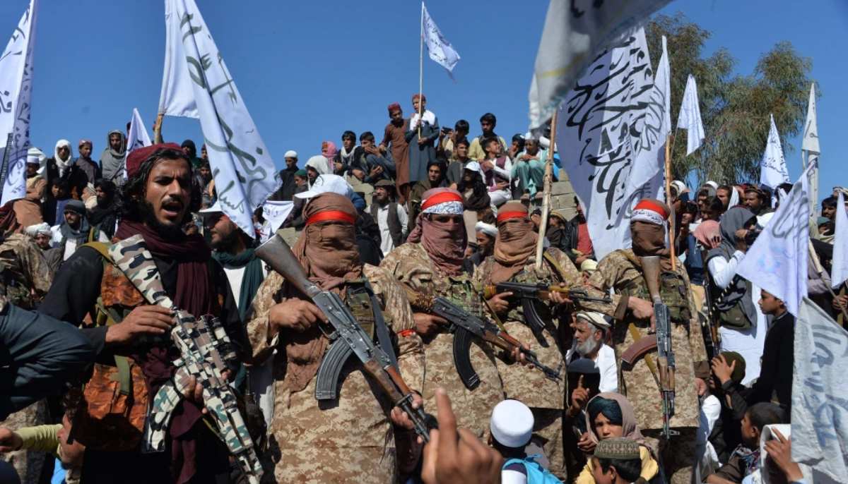 Members of the Afghan Taliban and villagers celebrate the peace deal and their victory in the Afghan conflict in the Alingar district of Laghman Province. — AFP/File