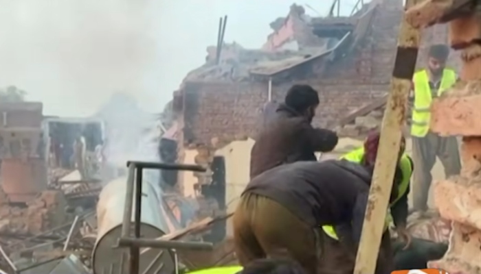 Rescue worksrs at the site of a factory blast in Faisalabad, November 21, 2025. — Screengrab via Geo News