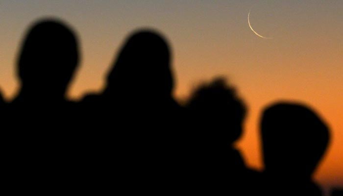 People sight moon in this undated image. — Reuters