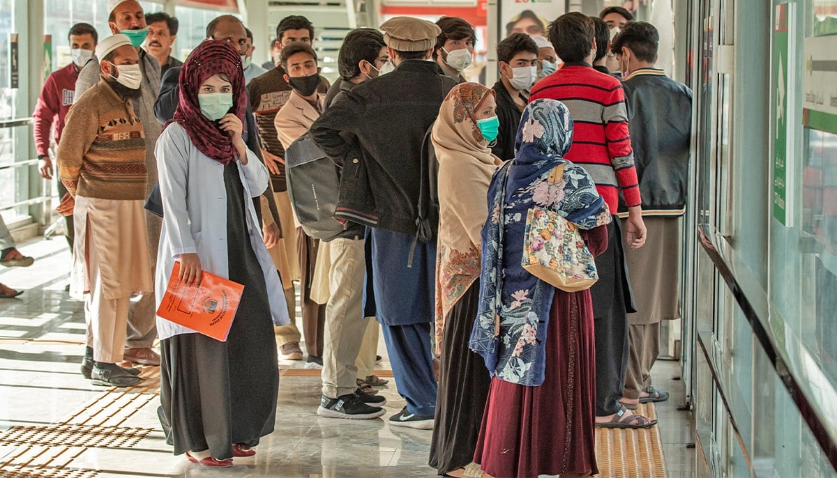 Women wait for the bus at one of the Bus Rapid Transit (BRT) station in Peshawar. — X/@TransPeshawar