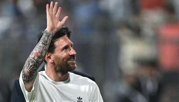 Argentinas footballer Lionel Messi greets fans during his Goat Tour at the Wankhede Stadium in Mumbai on December 14, 2025.— AFP
