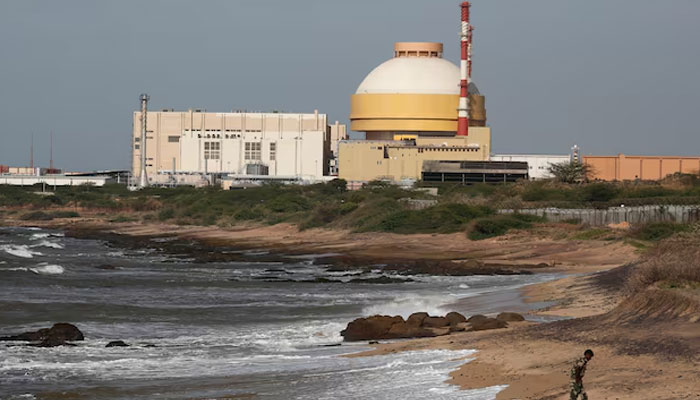 A policeman walks on a beach near Kudankulam nuclear power project in the southern Indian state of Tamil. — Reuters/File