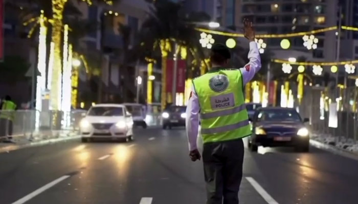 This image shows cop ensuring smooth traffic flow. —  Dubai police
