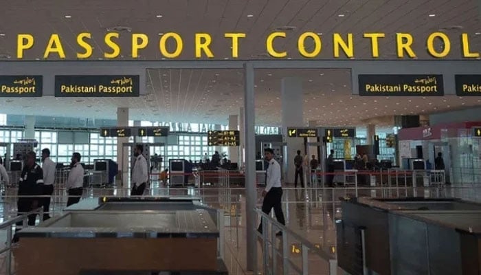 Airport staff walks through the Islamabad International Airport.— AFP/File