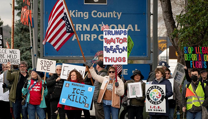 People gather for a protest against deportation flights at King County International Airport, which is used by US Immigration and Customs Enforcement (ICE), in Seattle, Washington, US, January 15, 2026. — Reuters