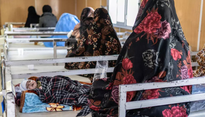 Afghan women with their children sit in the malnutrition ward of Doctors Without Borders (MSF) at a hospital in Herat, Afghanistan on January 8, 2026. — AFP