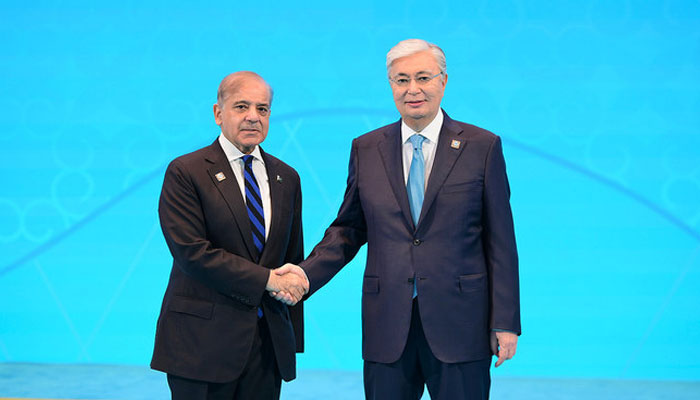 Prime Minister Shehbaz Sharif (left) shakes hands with Kazakhstan President Kassym-Jomart Tokayev as he arrives at the Independence Palace of Astana to attend Shanghai Cooperation Organisation Summit in Astana on July 4, 2024. — APP
