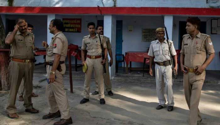 Indian policemen standing inside a police station in Uttar Pradesh, India. — Reuters