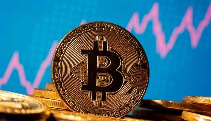 A representation of virtual currency Bitcoin is seen in front of a stock graph in this illustration taken January 8, 2021. — Reuters