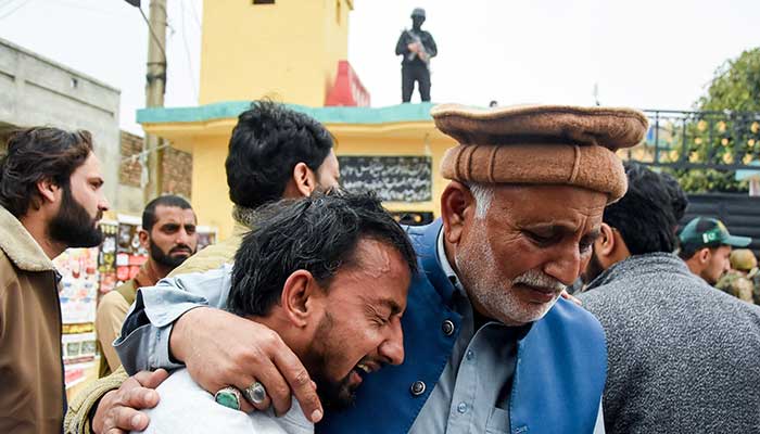 A man reacts while being comforted, after the deadly imambargah explosion in Islamabad, February 6, 2026. — Reuters