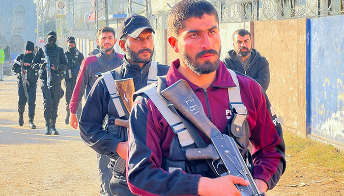 Police officers walk along a street following a deadly explosion at a mosque in Islamabad, on February 7, 2026. — Reuters