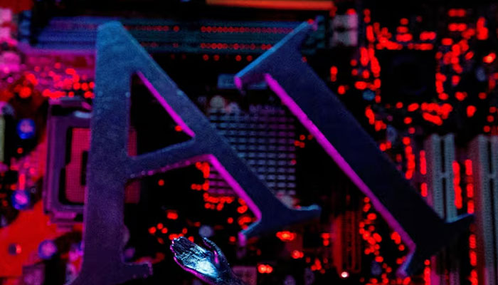AI (Artificial Intelligence) letters and robot hand are placed on computer motherboard in this illustration created on June 23, 2023. — Reuters