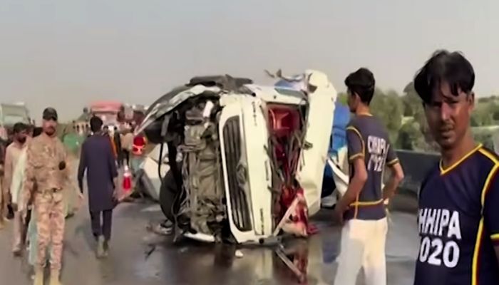An oil tanker lies overturned after the accident on the M-9 motorway as rescue personnel and law enforcement officials inspect the scene on February 13, 2025. — Screengrab via Geo News