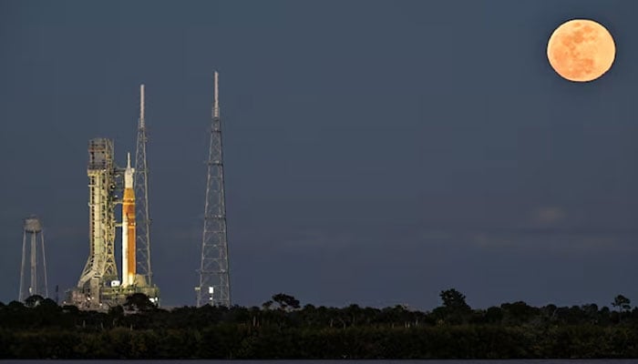 A full moon rises near the Space Launch System (SLS), with the Orion crew capsule, at launch complex 39B as preparations continue for the Artemis II mission to the Moon at Kennedy Space Centre in Cape Canaveral, Florida, US, February 1, 2026. — Reuters