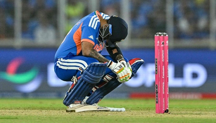 Indias captain Suryakumar Yadav reacts after being hit by the ball during the 2026 ICC Mens T20 Cricket World Cup Super Eights match between India and South Africa at the Narendra Modi Stadium in Ahmedabad on February 22, 2026. — AFP