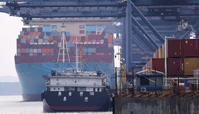 A cargo ship with containers docks at a terminal of the Yantian port in Shenzhen, Guangdong province, China, October 30, 2025. — Reuters