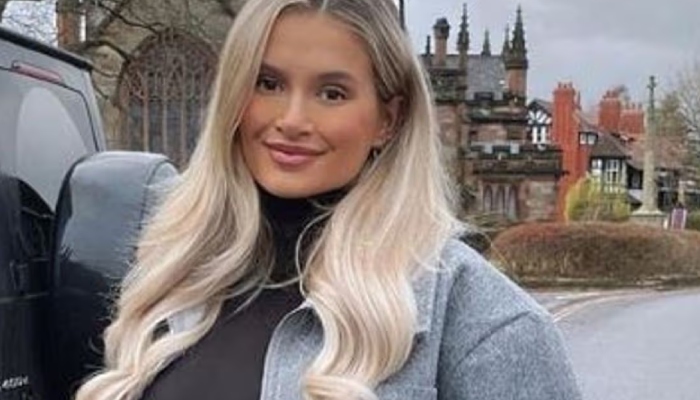 The Maebe founder covered her growing baby bump in a oversized zip-up bomber jacket