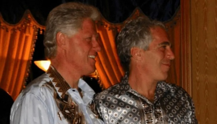 Former U.S. President Bill Clinton stands with Jeffrey Epstein in an image released by the US Justice Department on 19 December 19, 2025. — Reuters