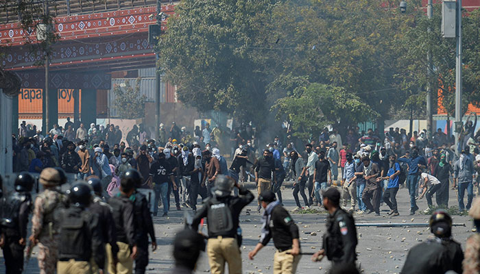 Protesters engage in a clash with security forces outside the U.S. Consulate General, following news of U.S. and Israeli strikes on Iran that martyred Irans Supreme Leader Ayatollah Ali Khamenei, in Karachi on March 1, 2026. — Reuters
