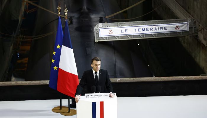 French President Emmanuel Macron delivers a speech next to the submarine Le Temeraire (The Temerarious) at the nuclear submarines Navy base Ile Longue in Crozon, France, March 2, 2026. — Reuters
