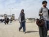 Pakistanis at remote border describe scramble to leave Iran