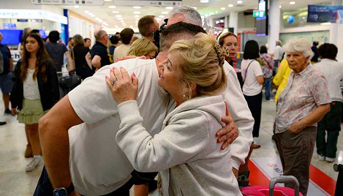 A passanger reacts after arriving from Dubai on a flight, amid the US-Israeli conflict with Iran, at Sydney international airport, in Mascot, Australia March 4, 2026. — Reuters