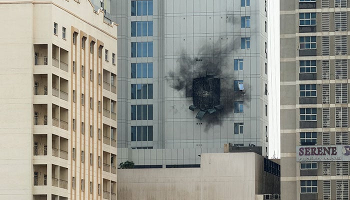 Damage caused by an Iranian drone strike on one of the buildings next to the Navy Base Headquarters of US Navy 5th Fleet in Juffair, Bahrain on March 4, 2026. — Reuters