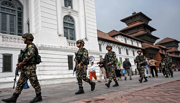 Nepal Army personnel patrol a street on the eve of Nepals parliamentary elections in Kathmandu on March 4, 2026. — AFP