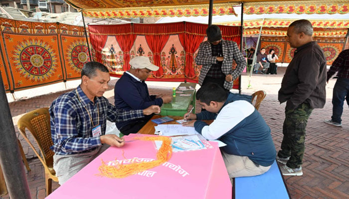 Polling officials prepare a polling booth ahead of Nepal´s general election in Kathmandu on March 4, 2026. — AFP