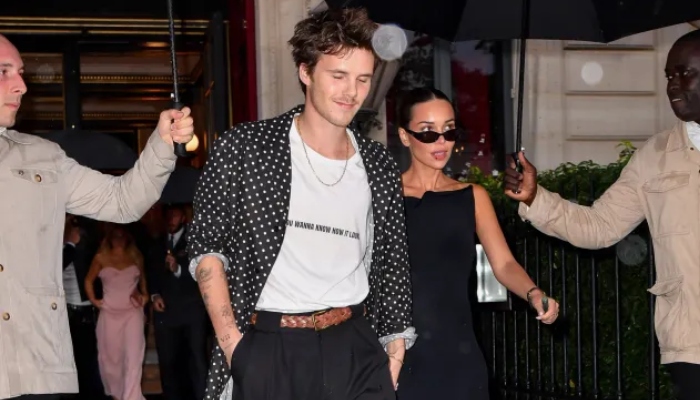 The couple sweetly held hands as they stepped out in France for Paris Fashion Week