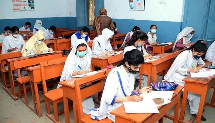 Students are solving question papers during their annual examination on July 27, 2021. — APP/File